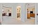 Upstairs hallway with views to bedroom, bathroom, and stairs to the main floor at 300 South Village Sq, Canton, GA 30115