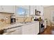 Bright kitchen with stainless steel appliances, granite countertops, and plenty of natural light at 300 South Village Sq, Canton, GA 30115