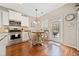Eat-in kitchen area with stainless steel appliances and granite countertops, access to outdoor patio at 300 South Village Sq, Canton, GA 30115