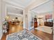 Open-concept living area with hardwood floors, access to an office, and a view of the living room at 300 South Village Sq, Canton, GA 30115