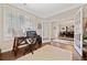 View of the office with hardwood floors, french doors, and view of dining room at 300 South Village Sq, Canton, GA 30115