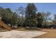 Spacious backyard featuring a concrete patio and lush landscaping, great for outdoor living at 950 Clairemont Ave, Decatur, GA 30030