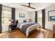 Bright bedroom featuring hardwood floors, modern decor, and large windows with natural light at 950 Clairemont Ave, Decatur, GA 30030