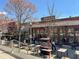 Street-level view of The Iberian Pig restaurant with outdoor seating, adding to the vibrant city scene at 950 Clairemont Ave, Decatur, GA 30030