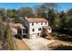 Charming two-story home with a stone foundation, attached garage, and a screened-in porch at 950 Clairemont Ave, Decatur, GA 30030