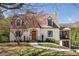 Charming brick home with a colorful front door and well-manicured landscaping at 950 Clairemont Ave, Decatur, GA 30030