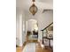 Elegant foyer featuring a staircase and light fixture leading to other rooms at 950 Clairemont Ave, Decatur, GA 30030