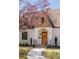 Close-up of the inviting front door with stone and brick accents on the home's exterior at 950 Clairemont Ave, Decatur, GA 30030