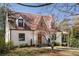 Charming home with brick exterior, dormer windows, a welcoming front door and manicured lawn at 950 Clairemont Ave, Decatur, GA 30030