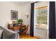 Cozy office nook with a wood desk, vintage typewriter, and a window with blue curtains at 950 Clairemont Ave, Decatur, GA 30030