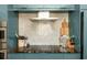 Clean kitchen with stainless steel vent hood and lots of cooking space at 950 Clairemont Ave, Decatur, GA 30030