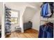 Walk-in closet featuring custom shoe rack and a window for natural light at 950 Clairemont Ave, Decatur, GA 30030