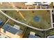 Aerial view of common area with fire pit and seating in new community at 58 Black Gum Ln # 47, Auburn, GA 30011