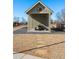 Outdoor picnic shelter set on a gravel lot with a stone pathway under a clear blue sky at 58 Black Gum Ln # 47, Auburn, GA 30011