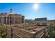 Garden plots and a community picnic structure with the municipal complex in the background on a sunny day at 58 Black Gum Ln # 47, Auburn, GA 30011