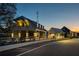 Striking building exteriors with a combination of architectural styles and open-air features, set against a twilight sky at 58 Black Gum Ln # 47, Auburn, GA 30011