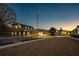 Scenic view of community buildings with distinct architectural details and well-manicured lawns under a twilight sky at 58 Black Gum Ln # 47, Auburn, GA 30011