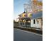 Picturesque exterior featuring metal roofing, dormer windows, and a cozy outdoor seating area at 58 Black Gum Ln # 47, Auburn, GA 30011