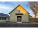 The Hive community center with a modern farmhouse design, featuring a covered entrance and green board and batten siding at 58 Black Gum Ln # 47, Auburn, GA 30011