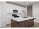 Gourmet kitchen boasts an island with a quartz countertop and stainless steel appliances at 58 Black Gum Ln # 47, Auburn, GA 30011