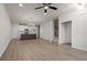 Open-concept living area features a modern kitchen, stairs, and beautiful light fixture at 58 Black Gum Ln # 47, Auburn, GA 30011