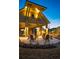 Outdoor patio area with comfortable seating and well-lit architectural details for evening enjoyment at 58 Black Gum Ln # 47, Auburn, GA 30011