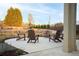 Relaxing community seating area with Adirondack chairs arranged around a concrete pad, complemented by hay bales and landscaping at 58 Black Gum Ln # 47, Auburn, GA 30011