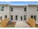 Backyard with a small patio and privacy fence, offering a cozy outdoor space at 312 Navigator Ln, Mcdonough, GA 30253