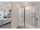 Bright bathroom with a glass-enclosed shower with built-in shelves at 312 Navigator Ln, Mcdonough, GA 30253