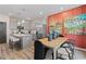 Bright kitchen features gray cabinets, stainless steel appliances, an island, and an adjacent dining area at 312 Navigator Ln, Mcdonough, GA 30253