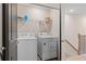 Laundry room featuring a washer, dryer, and wire shelving for storage at 312 Navigator Ln, Mcdonough, GA 30253