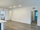 Open-concept living area with clean lines, recessed lighting, and convenient access to laundry room at 3321 Orwell Way # 3106, Cumming, GA 30041