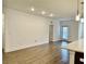 Bright living room featuring hardwood floors and recessed lighting for a modern, airy feel at 3321 Orwell Way # 3106, Cumming, GA 30041