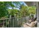 Relaxing balcony with wrought iron railing and cushioned chairs overlooking lush greenery at 3203 Lenox Ne Rd # 3, Atlanta, GA 30324