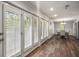 Elegant dining area with hardwood floors, white trim, and a view of the landscaped grounds at 3203 Lenox Ne Rd # 3, Atlanta, GA 30324