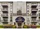 Exterior view of the The James at Buckhead featuring balconies, a large window, and neatly manicured landscaping at 3203 Lenox Ne Rd # 3, Atlanta, GA 30324