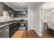 Modern kitchen features stainless steel appliances, granite countertops, and dark wood cabinets at 3203 Lenox Ne Rd # 3, Atlanta, GA 30324