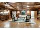 Traditional living room with wood paneled walls and coffered ceiling at 3203 Lenox Ne Rd # 3, Atlanta, GA 30324