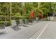 Relaxing pool deck area with lounge chairs, umbrellas, and well-maintained landscaping at 3203 Lenox Ne Rd # 3, Atlanta, GA 30324