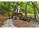 Picturesque walking path with a wooden bridge and stone steps, surrounded by lush greenery and mature trees at 3203 Lenox Ne Rd # 3, Atlanta, GA 30324