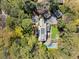 Aerial view of a luxury home with a pool, lush greenery, and stone patio at 3540 Tuxedo Nw Rd, Atlanta, GA 30305