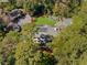 Aerial view of the property with mature trees, pool, and outdoor kitchen at 3540 Tuxedo Nw Rd, Atlanta, GA 30305