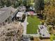 An elegant home featuring a well-manicured lawn, stone patio, and an outdoor seating area at 3540 Tuxedo Nw Rd, Atlanta, GA 30305