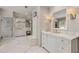Modern bathroom featuring marble countertops, a large vanity and a glass shower at 3540 Tuxedo Nw Rd, Atlanta, GA 30305