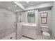 Bright bathroom featuring a glass enclosed shower, white vanity, and neutral walls at 3540 Tuxedo Nw Rd, Atlanta, GA 30305