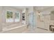 Elegant bathroom featuring soaking tub, glass shower, and marble floors at 3540 Tuxedo Nw Rd, Atlanta, GA 30305