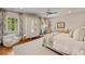 Bright bedroom features a ceiling fan, a mirrored wardrobe, and room to play; perfect for a growing  at 3540 Tuxedo Nw Rd, Atlanta, GA 30305