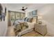 Well-lit bedroom featuring a ceiling fan, modern decor, and a serene ambiance at 3540 Tuxedo Nw Rd, Atlanta, GA 30305