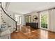 Welcoming entryway featuring hardwood floors, staircase, and a view into the adjoining rooms at 3540 Tuxedo Nw Rd, Atlanta, GA 30305