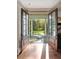 Charming entryway with hardwood floors leading to an open outdoor view at 3540 Tuxedo Nw Rd, Atlanta, GA 30305